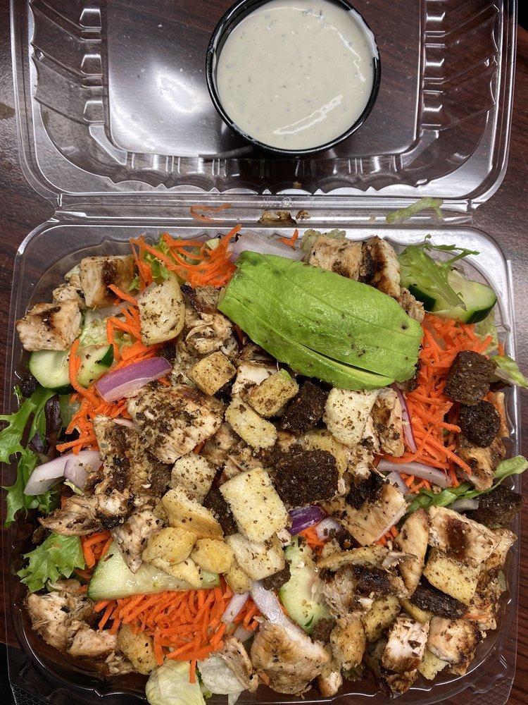 California Chicken Salad · Marinated grilled chicken on a garden salad with avocado, garbanzo beans, red onion, and feta cheese. Choice of dressing on the side.