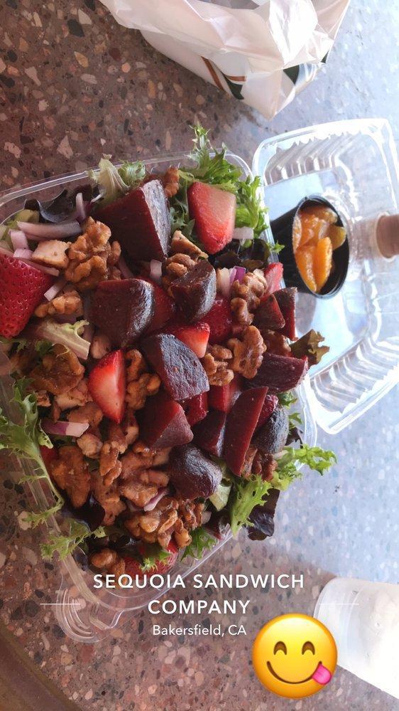 Spring Salad · Fresh field greens and butter leaf lettuce topped with sliced strawberries mandarin oranges, honey maple walnuts, and slides red onions with our homemade poppy seed dressing on the side.  Made with dried cranberries October to March.