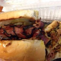 California Pastrami Sandwich · Tender, juicy pastrami served on a warm French roll with melted Swiss cheese, yellow mustard...