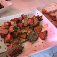 Patatas Bravas · Fried potatoes served with our famous 