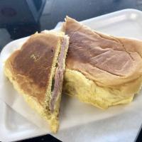 Media Noche Sandwich · Midnight sandwich on sweet bread with ham, pork and Swiss cheese.