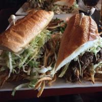 Steel City Sandwich · Beef brisket with melted mozzarella cheese,  fries and citrus slaw.