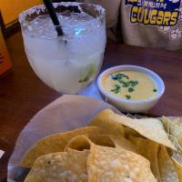 Queso · Melted blend of cheeses with spicy peppers and homemade corn tortillas or warm chips.