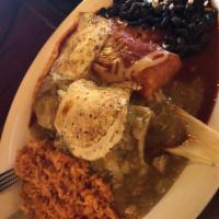 Tamales · Chicken tamales topped with green chile and queso fresco.