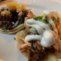 Al Pastor Taco · Achiote marinated pork, chopped pineapple, onions and cilantro.