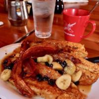Bananas Foster Pain Perdu · A New Orleans brunch favorite! French bread French toast, covered with rum-flambeed banana, ...