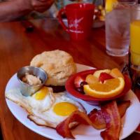 Southern Breakfast · 2 eggs any style, stone-ground grits, applewood-smoked bacon, buttermilk biscuit and a fried...