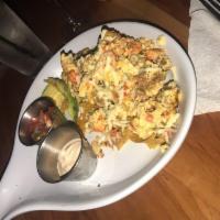 Migas · A Tex-mex egg scramble with spicy chorizo sausage, pico de gallo and pepperjack cheese over ...
