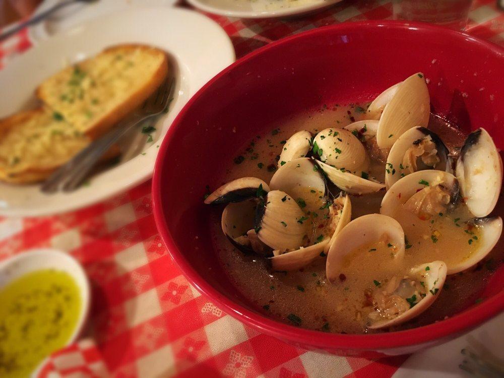 Steamed Clams · 1 lb. of clams in a spicy, garlic herb wine broth served with garlic bread.