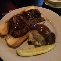 Pot Roast · Tender beef, slow cooked with onions, carrots and celery, served with mashed potatoes and gr...