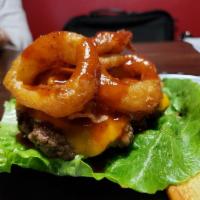 BBQ Bacon Cheese Burger · Delicious Angus beef patty 1/2 lb, topped with cheddar cheese, bacon, onion rings, finished ...
