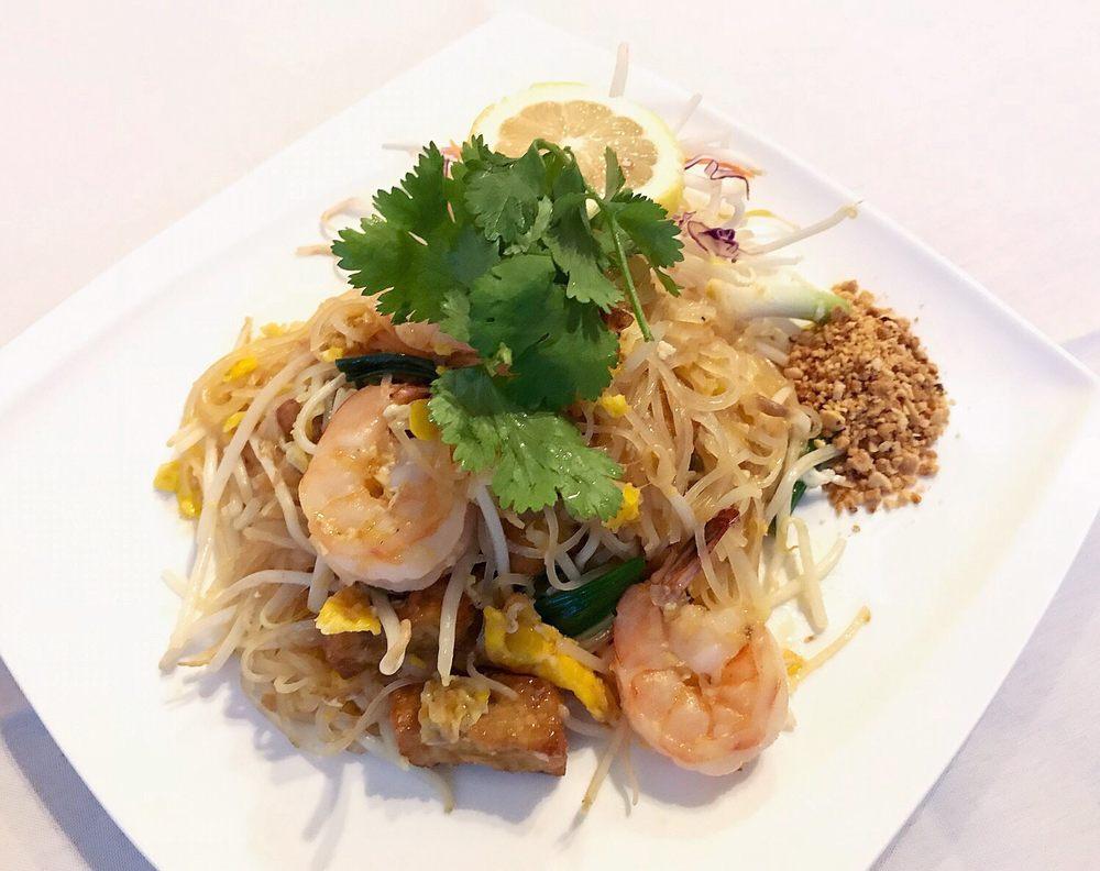 Pad Thai · Choice of meat, pan-fried with small rice noodles, egg, fried tofu, green onions, bean sprouts and ground peanuts.