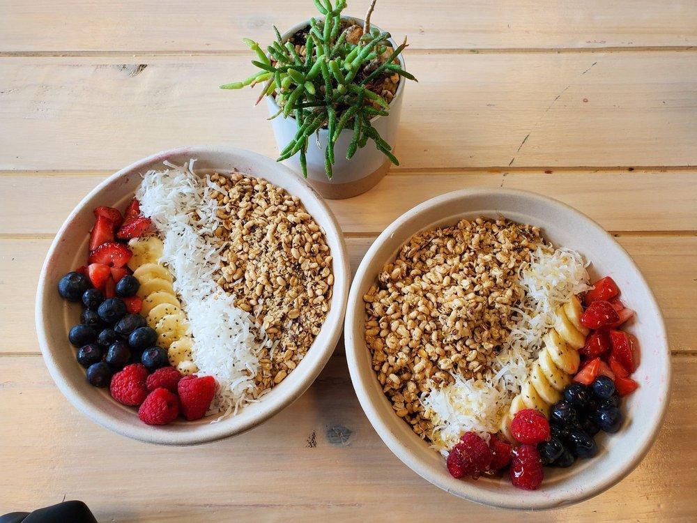 Skinny Acai Bowl · Organic acai, almond milk, banana, strawberry, mango, granola, topped with banana, chia seeds, blueberry, raspberry, cocoa nibs coconut shaves and bee pollen.