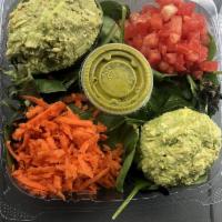 Cilantro-lime Avocado Chicken Salad · Whole stuffed avocado, served with organic spring mix salad, tomato, carrot with homemade ve...