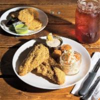 Catfish Entree Platter · Cornmeal dusted Golden Fried Mississippi Catfish over 1/2 lb. with Corn Hush puppy, Fried Ok...