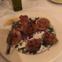 Clams Casino · Clam in a halfshell that has been covered in bacon and a variety of toppings