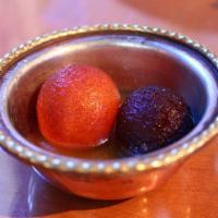 Gulab Jamun · Spongy milk ball cakes soaked in rose scented sryup.