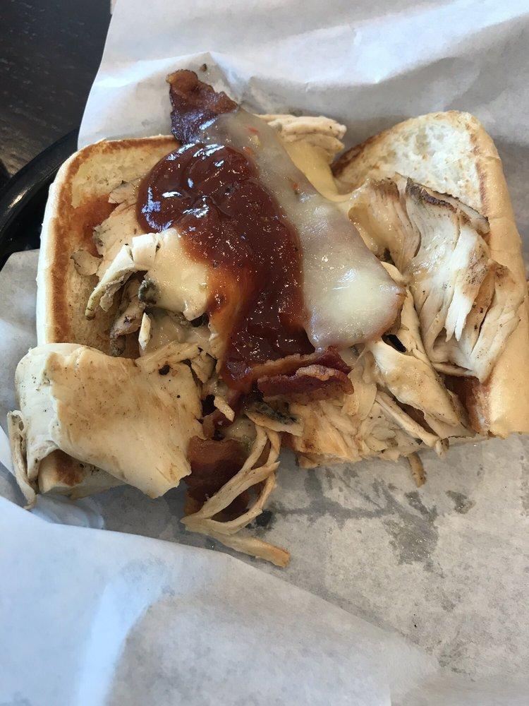 BBQ Chicken Sandwich · Sliced chicken breast grilled with melted pepper jack cheese, and topped with BBQ sauce and bacon, served on a warm French roll.