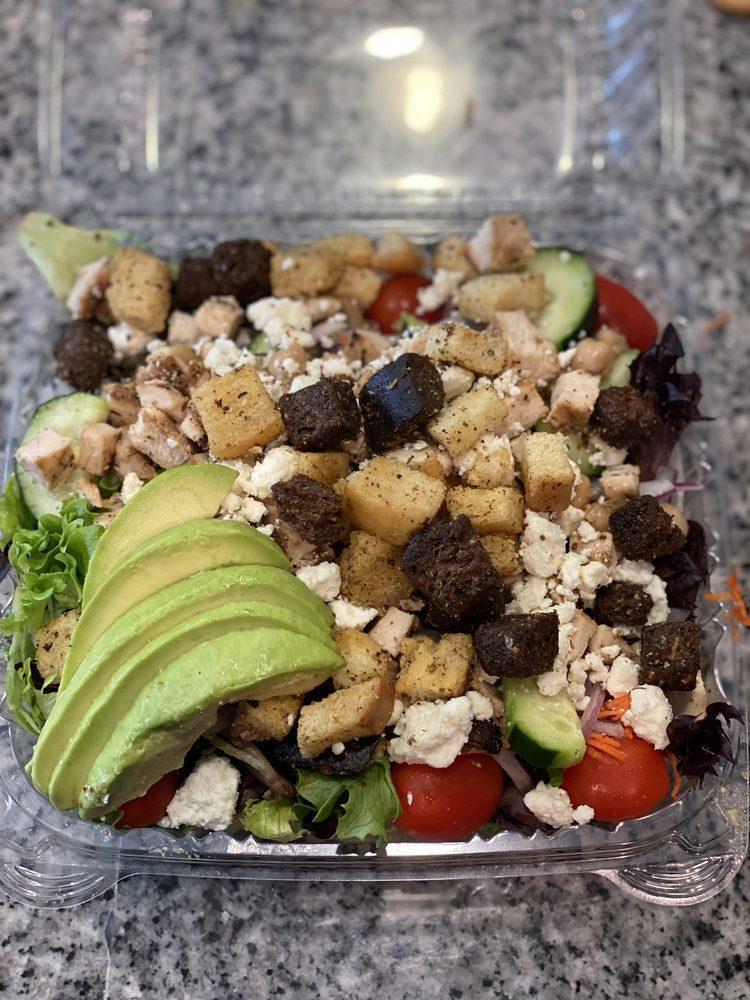 California Chicken Salad · Marinated grilled chicken on a garden salad with avocado, garbanzo beans, red onion, and feta cheese. Choice of dressing on the side.