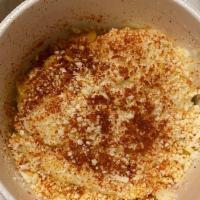 Esquite · Fresh elote (corn) in a cup. The corn is topped with mayonnaise, then queso fresco and chile...