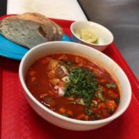 Menudo · Delicious beef tripe stew with red chili pepper base.