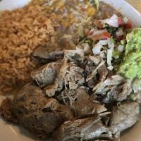 Carnitas · Tender chunks of lean pork marinated in lemon and garlic, then cooked to perfection. Served ...