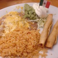 Taquitos · 4 crispy corn tortillas made with your choice of protein and served with guacamole and sour ...