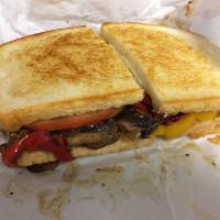 Hot Vegetarian Sandwich · Roasted eggplant, peppers and mushrooms with freshly sliced tomatoes, topped with Parmesan c...