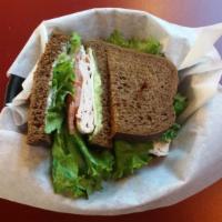 Roasted Turkey Breast Sandwich · Served on squaw bread with baby Swiss cheese, mayo, avocado, lettuce and tomato.
