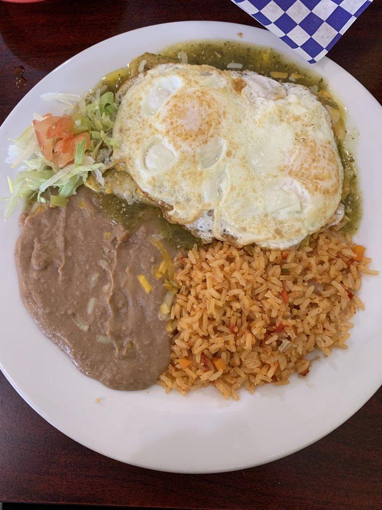 Cheese Enchiladas · 2 corn tortillas stuffed with shredded cheese topped with homemade verde sauce and sour cream. Served with rice and borracho beans.