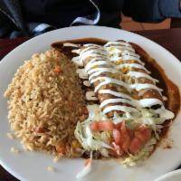 Ground Beef Enchiladas · 2 corn tortillas stuffed with beef topped homemade red enchilada sauce, shredded cheese and ...