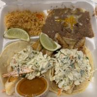 Fish Tacos · Grilled or breaded tilapia topped with coleslaw on corn or flour tortillas. Served with rice...