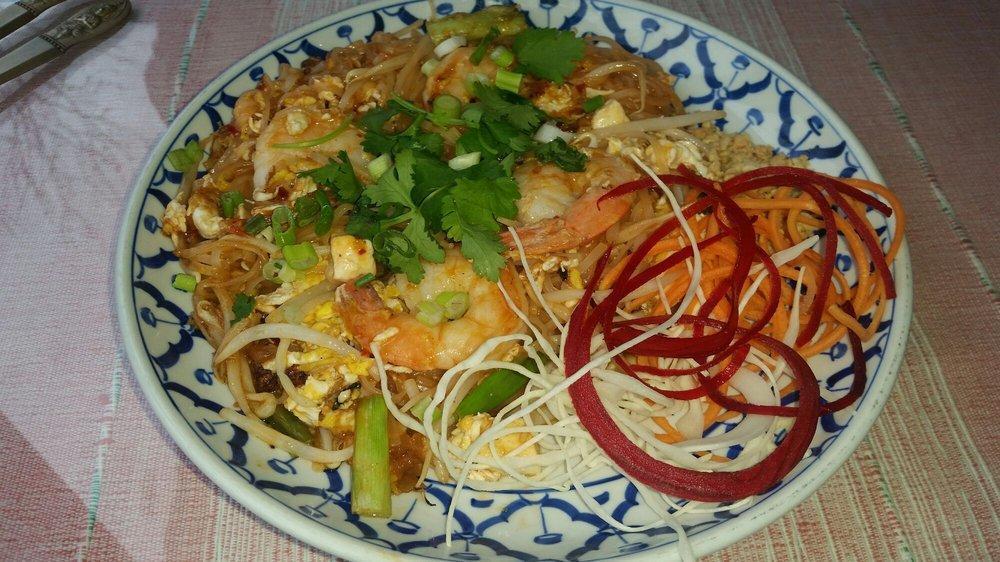 Pad Thai · Stir-fried rice noodles tossed with shrimp, egg, tofu, bean sprout, and topped with chopped peanuts.