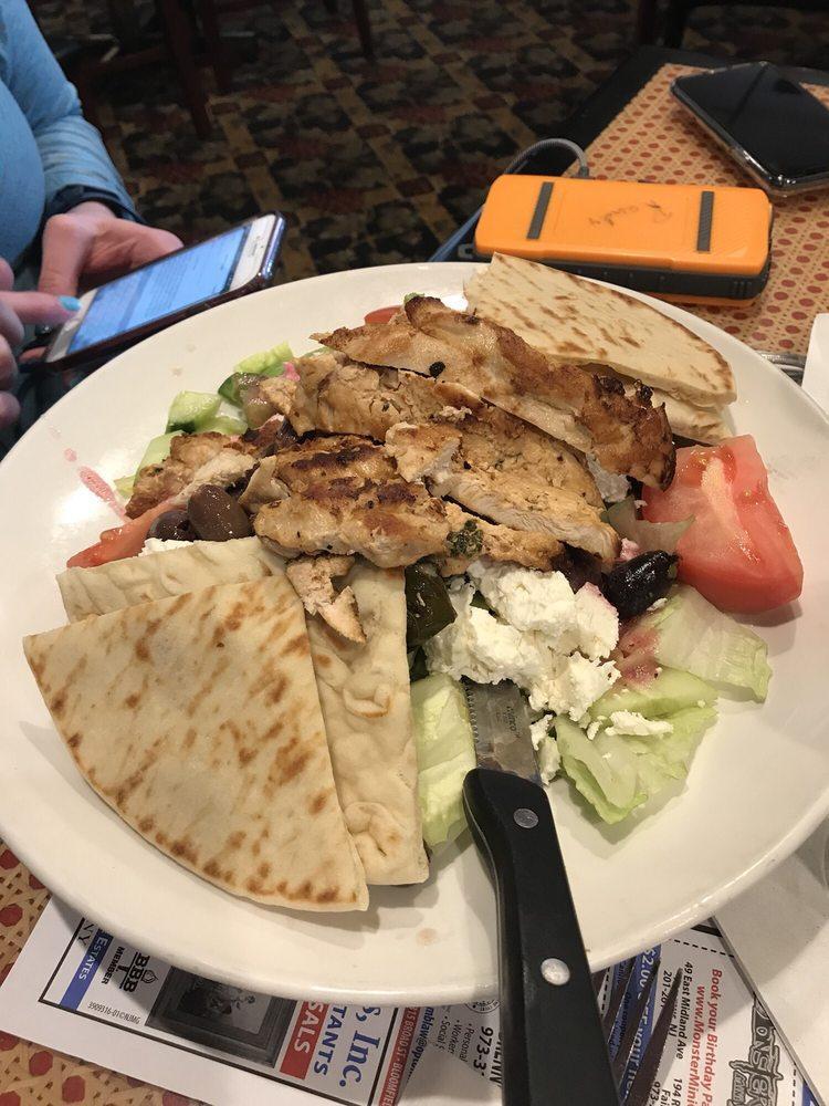 Greek Salad · With onions, fresh garden vegetables, olives, feta cheese, stuffed grape leaves, anchovies and our special house dressing, served with sliced pita bread.