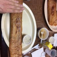 Masala Dosa · Filled with mildly spiced mashed potatoes and onions. Thin crepe made with rice lentil ferme...