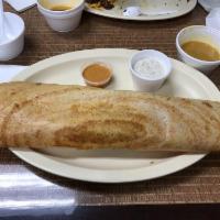 Mysore Masala Dosa · Crepe spread with spicy homemade sauce and filled with mashed potato. Thin crepe made with r...