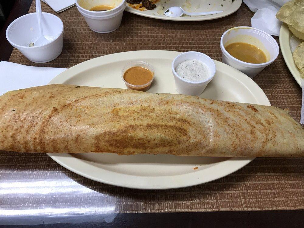 Mysore Masala Dosa · Crepe spread with spicy homemade sauce and filled with mashed potato. Thin crepe made with rice lentil fermented batter.