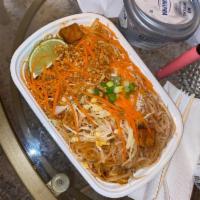 Pad Thai · Traditional stir fried rice noodle dish with egg, bean sprout garnished with fresh ground pe...