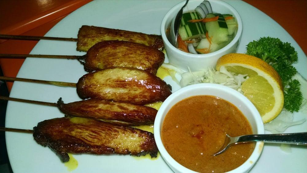 Chicken Satay · Charbroiled chicken on skewers served with peanut sauce and cucumber salad.