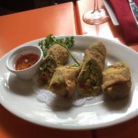 Avocados and Mango Egg Rolls · Crispy golden wontons wrap a tantalizing blend of avocados, mangos, red onions, red peppers ...