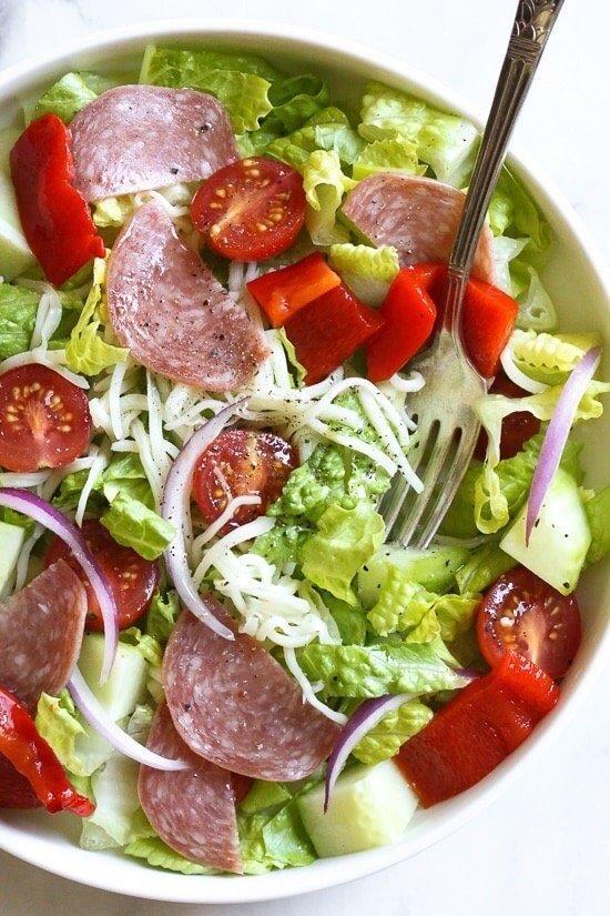 Italian Salad · Chopped romaine, bell peppers, salami, mozzarella, Kalamata olives, tomatoes, artichoke hearts, pepperoncini's and Italian dressing.