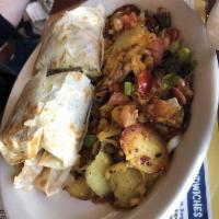 Meat Lover's Lumberjack Burrito · Housemade hash browns with scrambled eggs, sausage, bacon, ham, cheddar and Swiss cheese all...