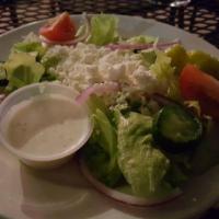 Greek Salad · Romaine lettuce, tomatoes, cucumber, and topped with feta cheese and Kalamata olives. 