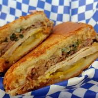Cuban Sandwich · The Monti. Smoked pork loin, pulled pork, pickles, swiss, chimichurri, mustard on a pressed ...