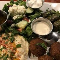 Mediterranean Platter with Dolmas · Choice of 3 items from below +  dolmas 
Choose greek salad, hummus, baba, Tuscan beans,  ric...