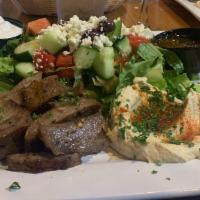Open Gyro · Gyro meat, hummus and Greek salad.