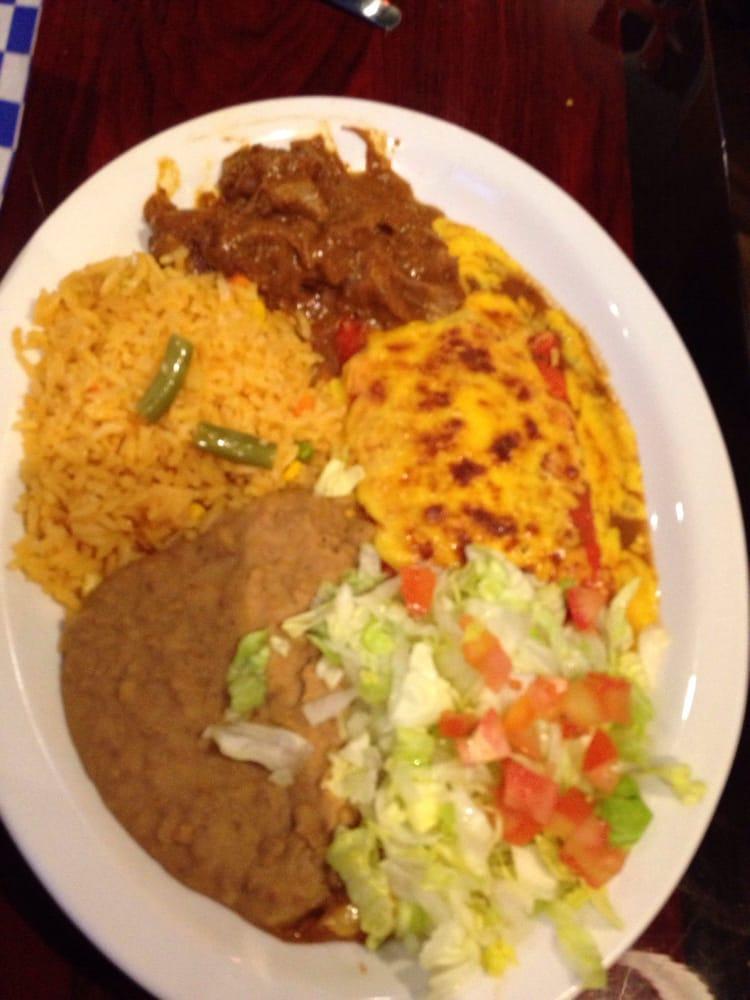 San Antonio Plate · 2 cheese enchiladas covered with homemade enchilada sauce with a side of carne guisada. Served with rice, beans, and 2 homemade tortillas.