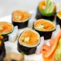 Dragon Eye Maki · Salmon, wasabi flying fish roe and Japanese basil wrapped with cucumber and squid dressed in...