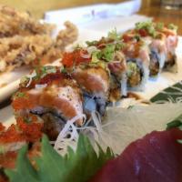 Chef Tony Salmon Maki · Crab stick, avocado, tempura flakes, spicy mayo, topped with seared salmon, mayo, flying fis...
