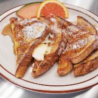 French Toast · Thick sweet & golden slices of classic french toast dusted with powdered sugar.